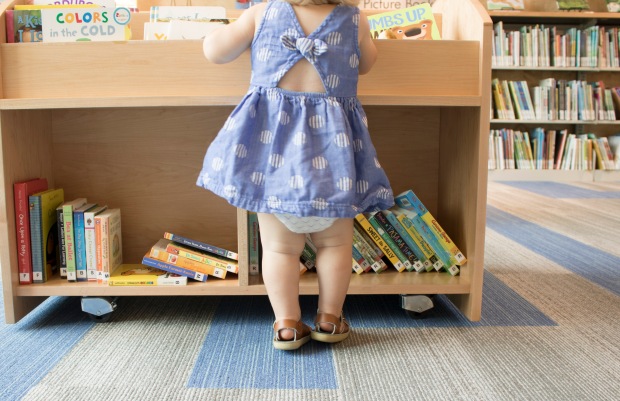 baby-looking-for-a-book-baby-legs